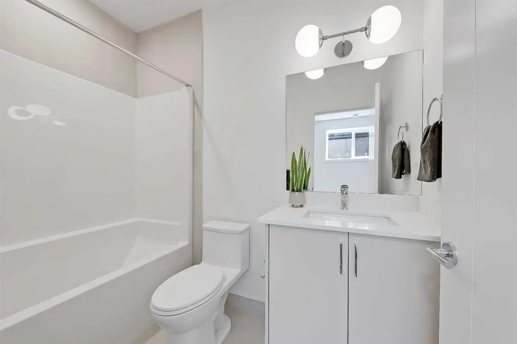Full bathroom with tub-shower combo and floating vanity