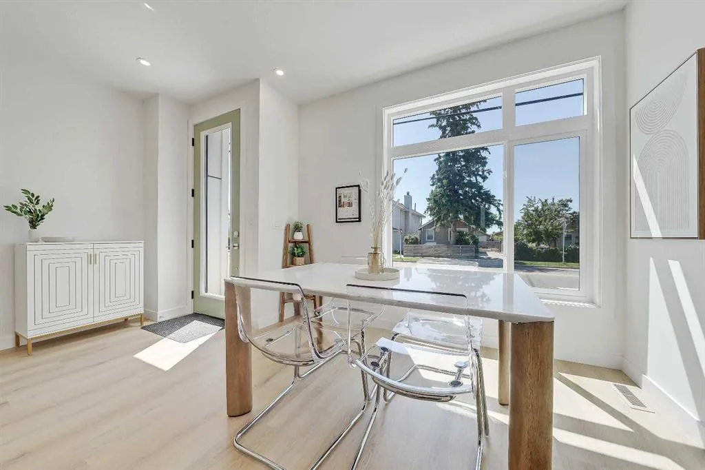 Dining area near the front entry with console table and window view