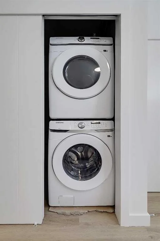 Stacked washer and dryer in a hallway closet